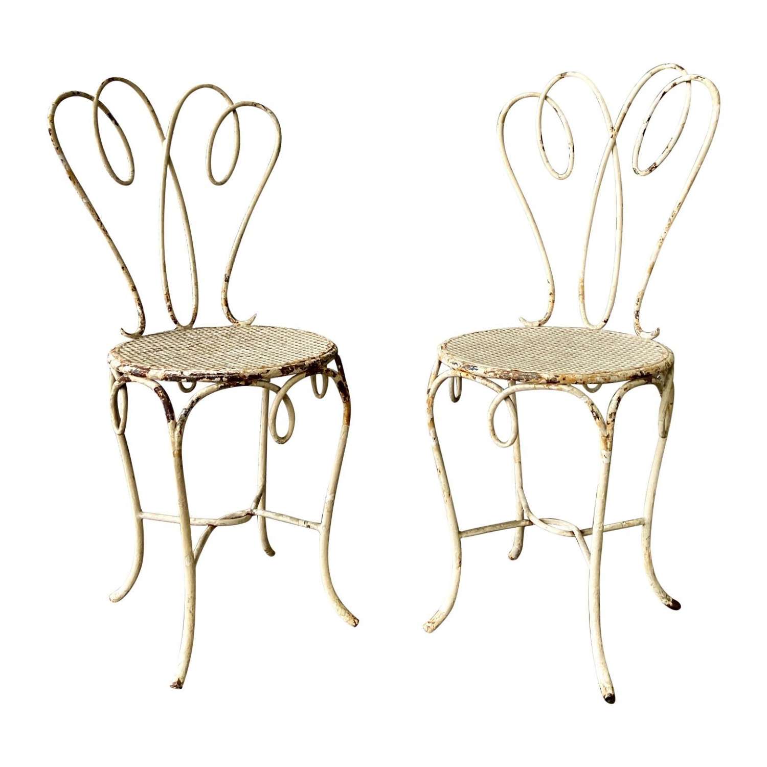 Pair, small 1950's painted iron garden side chairs, distressed white